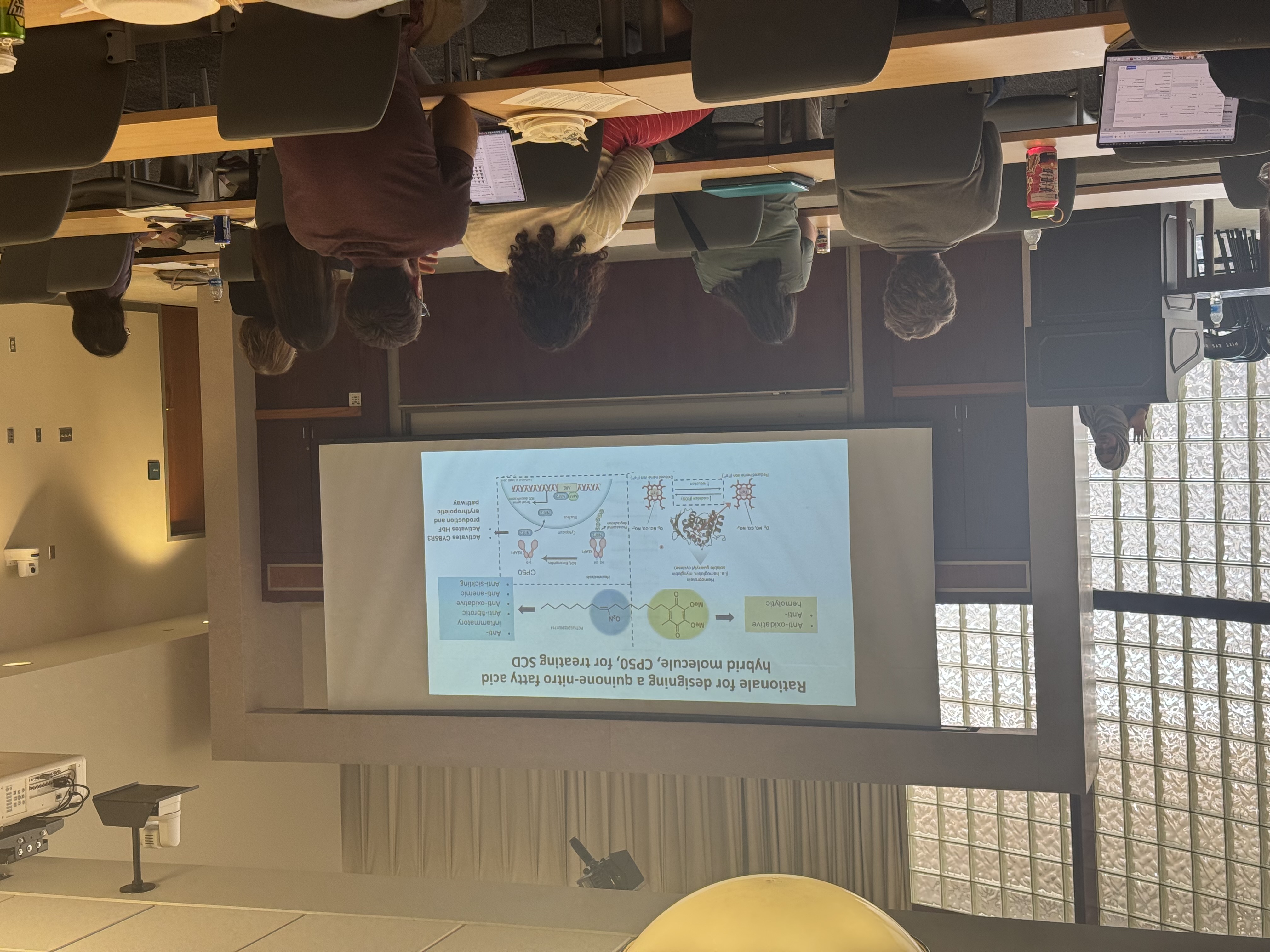 photo of presenter and audience and local retreat